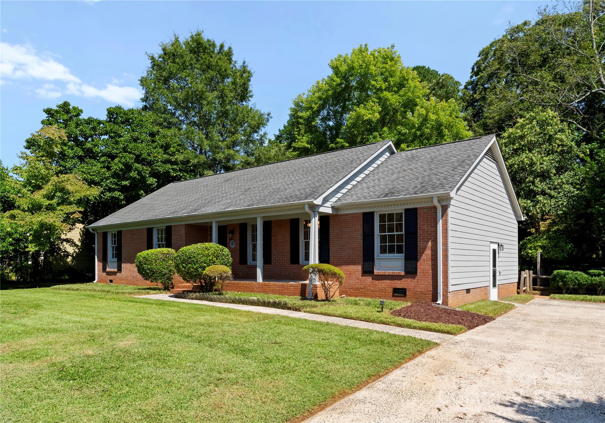 6101 Powder Horn Road Charlotte, NC 28212 - Photo 21 of 27 a view of a house with a yard and potted plants