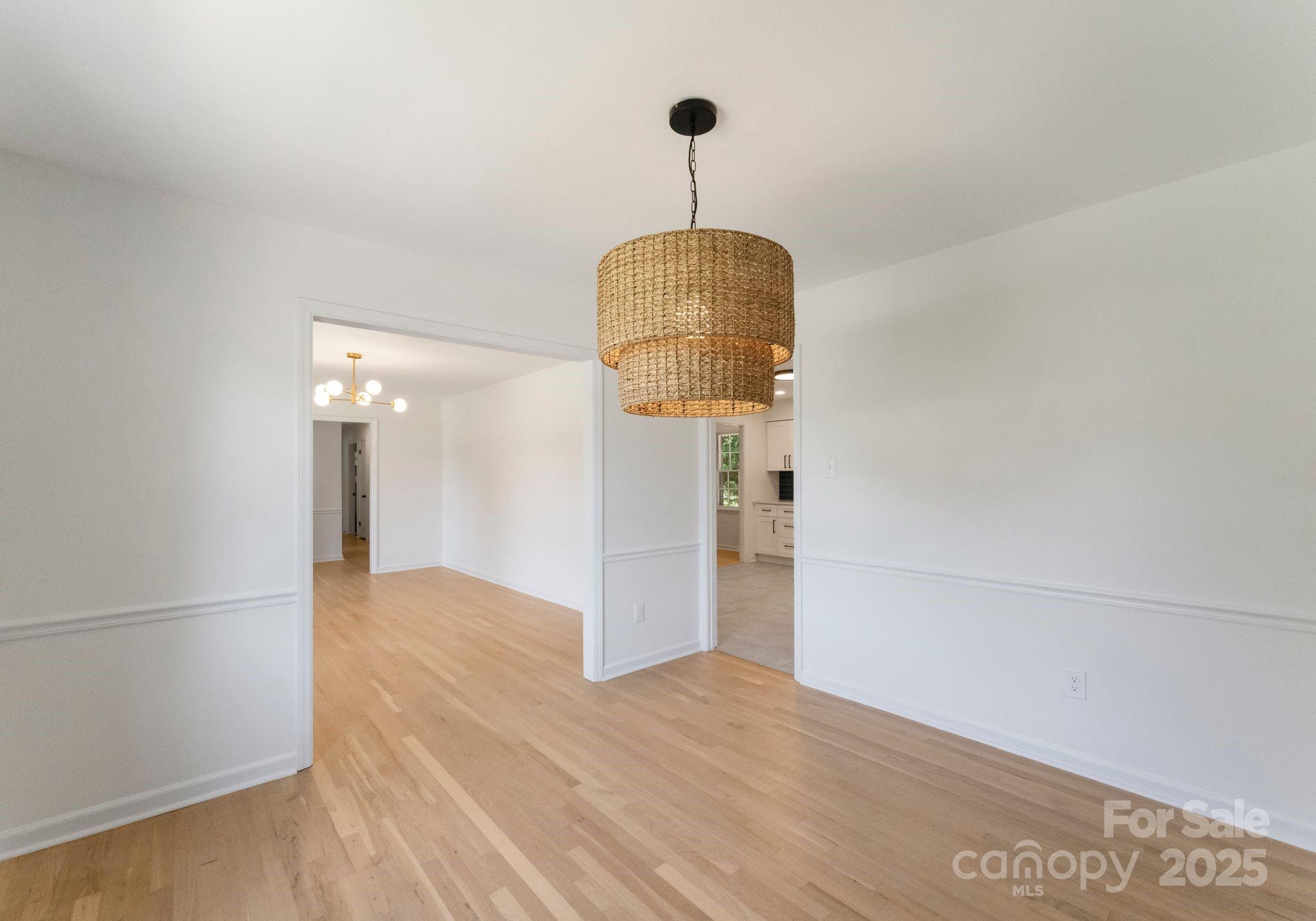 6101 Powder Horn Road Charlotte, NC 28212 - Photo 26 of 27 a walk in closet with wooden floor