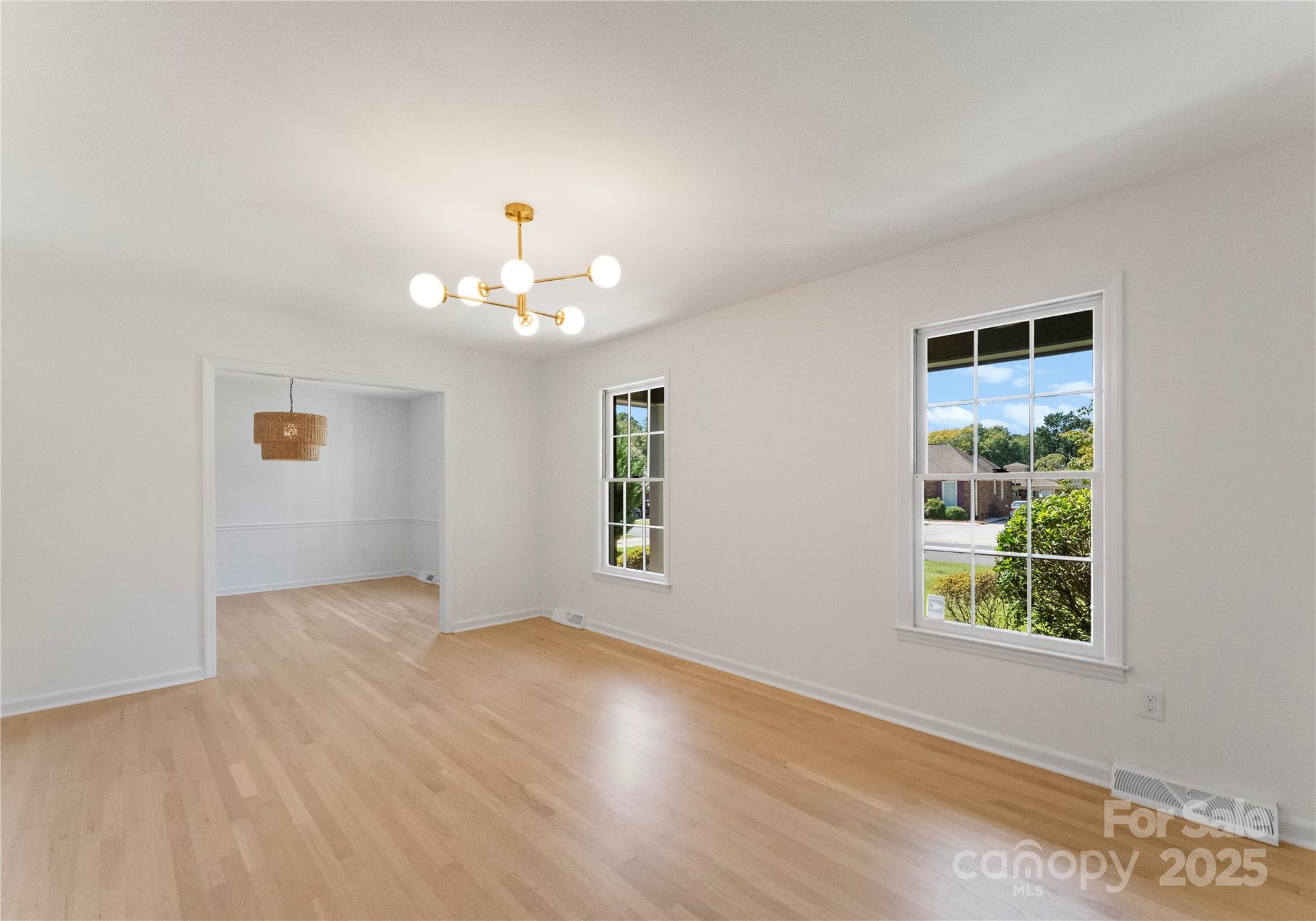 6101 Powder Horn Road Charlotte, NC 28212 - Photo 3 of 27 wooden floor in an empty room with a window