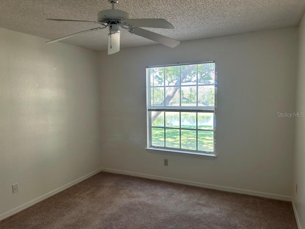1013 South Hiawassee Road, Unit 3626 Orlando, FL 32835 - Photo 21 of 28 an empty room with a window and a fan