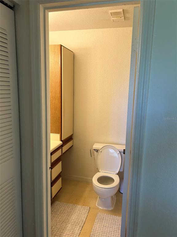 1013 South Hiawassee Road, Unit 3626 Orlando, FL 32835 - Photo 24 of 28 a bathroom with a toilet and a shower