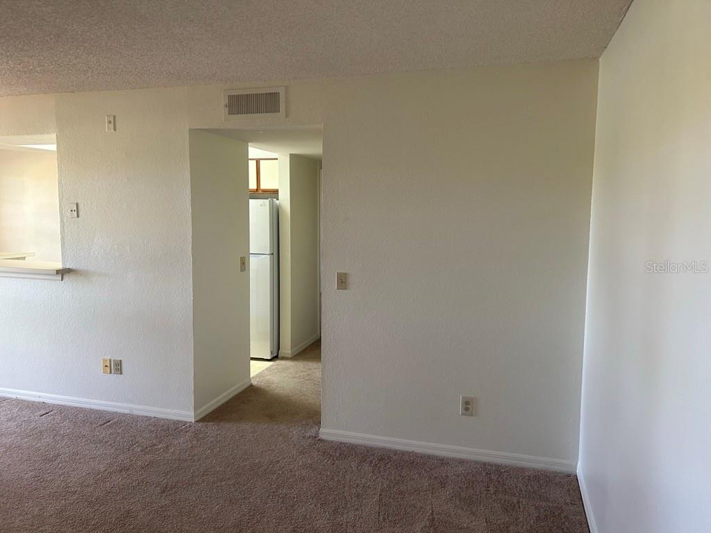 1013 South Hiawassee Road, Unit 3626 Orlando, FL 32835 - Photo 6 of 28 an empty room with windows and closet