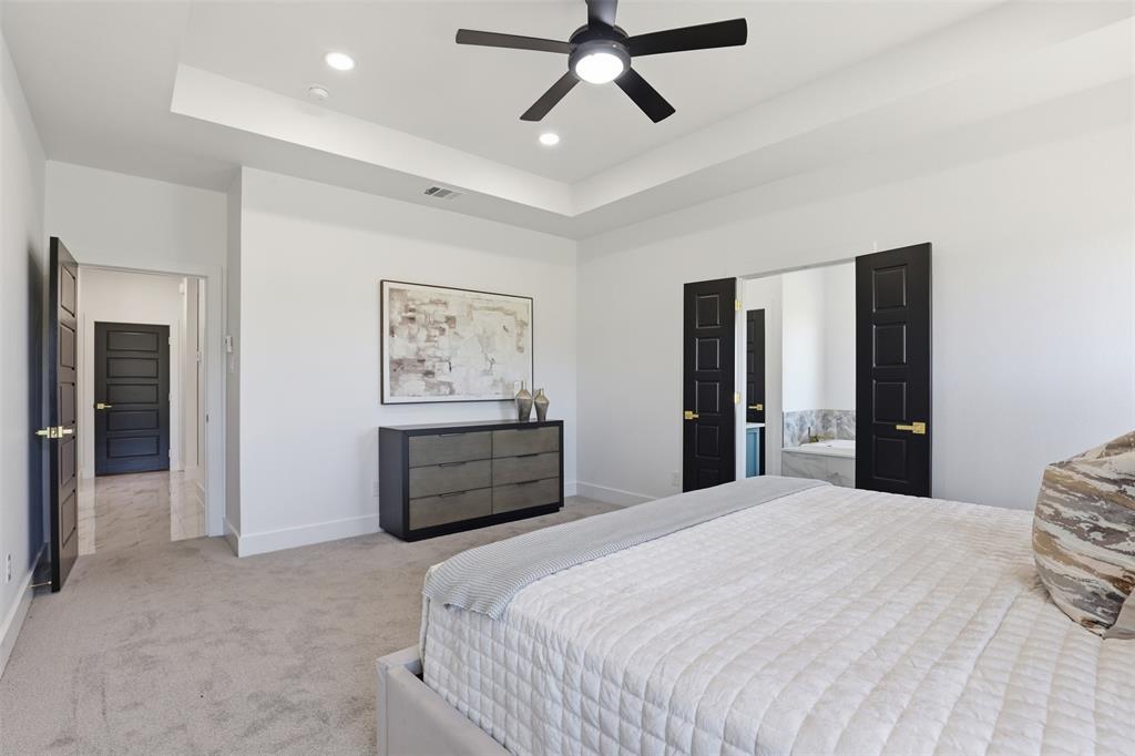 6657 Buffalo Ridge Circle Godley, TX 76044 - Photo 17 of 31 a bedroom with a bed and painting on the wall