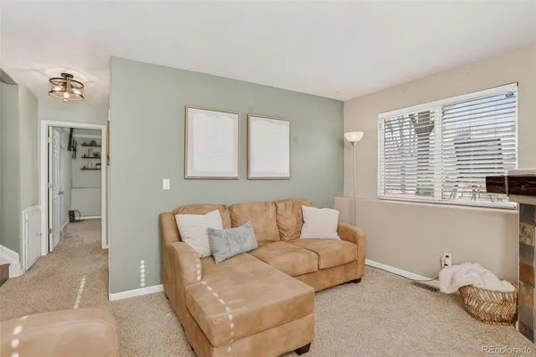 a living room with furniture and window