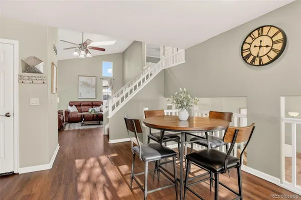 a view of a dining room with furniture and wooden floor