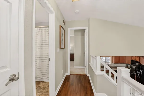 a view of a kitchen from the hallway