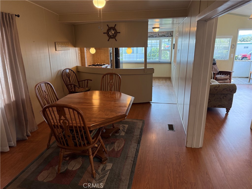 1701 Los Osos Valley Road, Unit 39 Los Osos, CA 93402 - Photo 12 of 18 a view of a dining room with furniture and wooden floor
