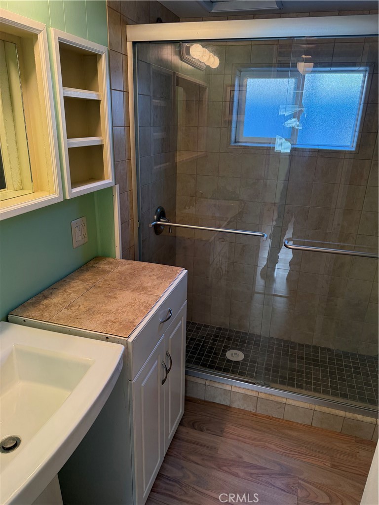 1701 Los Osos Valley Road, Unit 39 Los Osos, CA 93402 - Photo 15 of 18 a bathroom with a granite countertop sink and a mirror