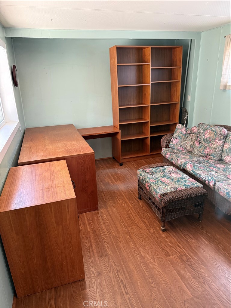 1701 Los Osos Valley Road, Unit 39 Los Osos, CA 93402 - Photo 16 of 18 a living room with furniture and a wooden floor