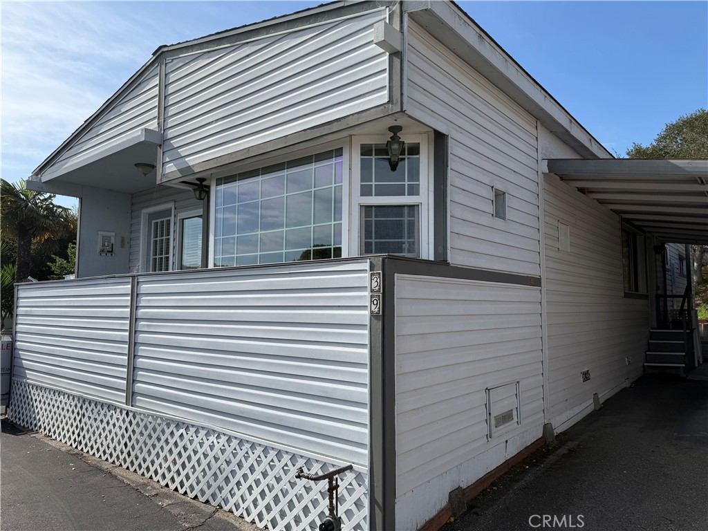 1701 Los Osos Valley Road, Unit 39 Los Osos, CA 93402 - Photo 2 of 18 a view of a white house with many windows