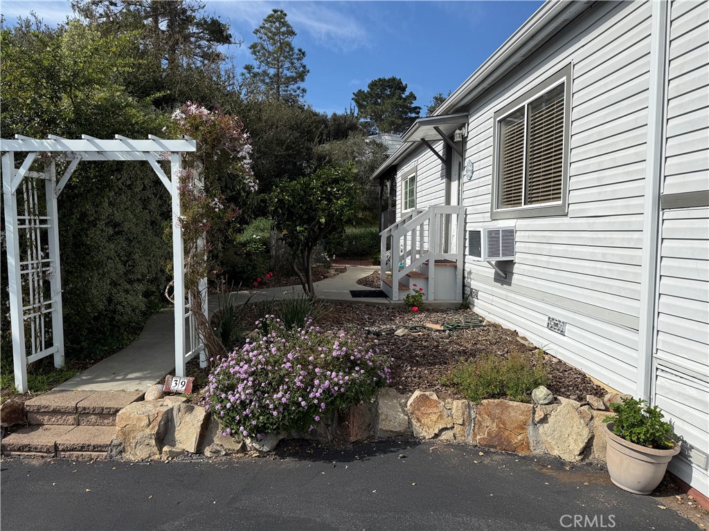 1701 Los Osos Valley Road, Unit 39 Los Osos, CA 93402 - Photo 3 of 18 a view of a chair and table in the patio