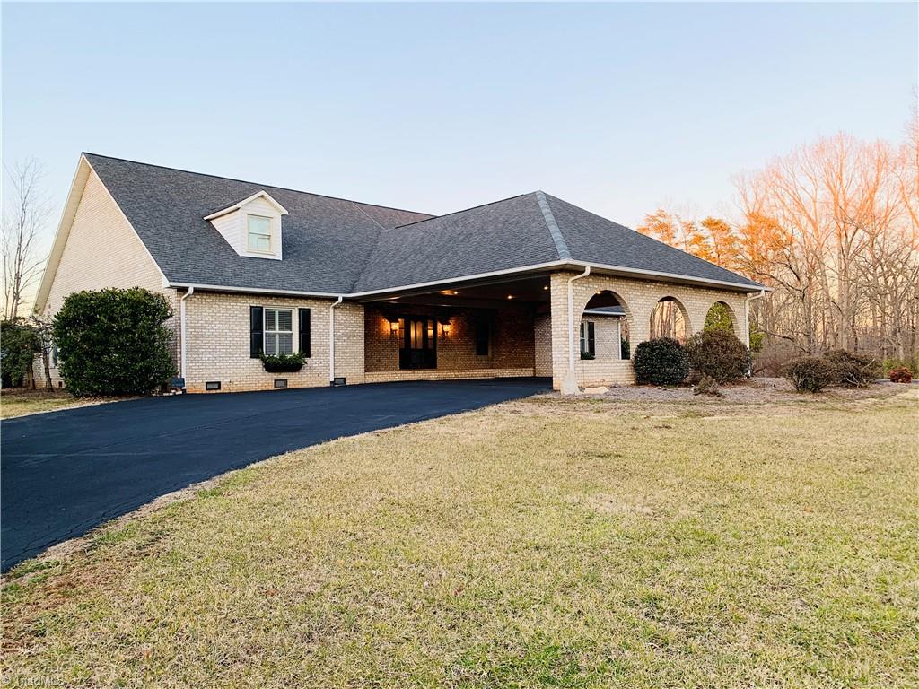 1198 Big Oak Road Germanton, NC 27019 - Photo 2 of 50 Massive carport could easily cover four cars. There is also additional parking hear the side porch.