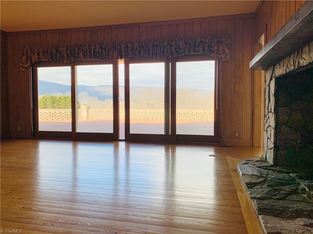 1198 Big Oak Road Germanton, NC 27019 - Photo 12 of 50 The VIEWS! Watch the seasons change through these sliding doors that open to wonderful brick patio.