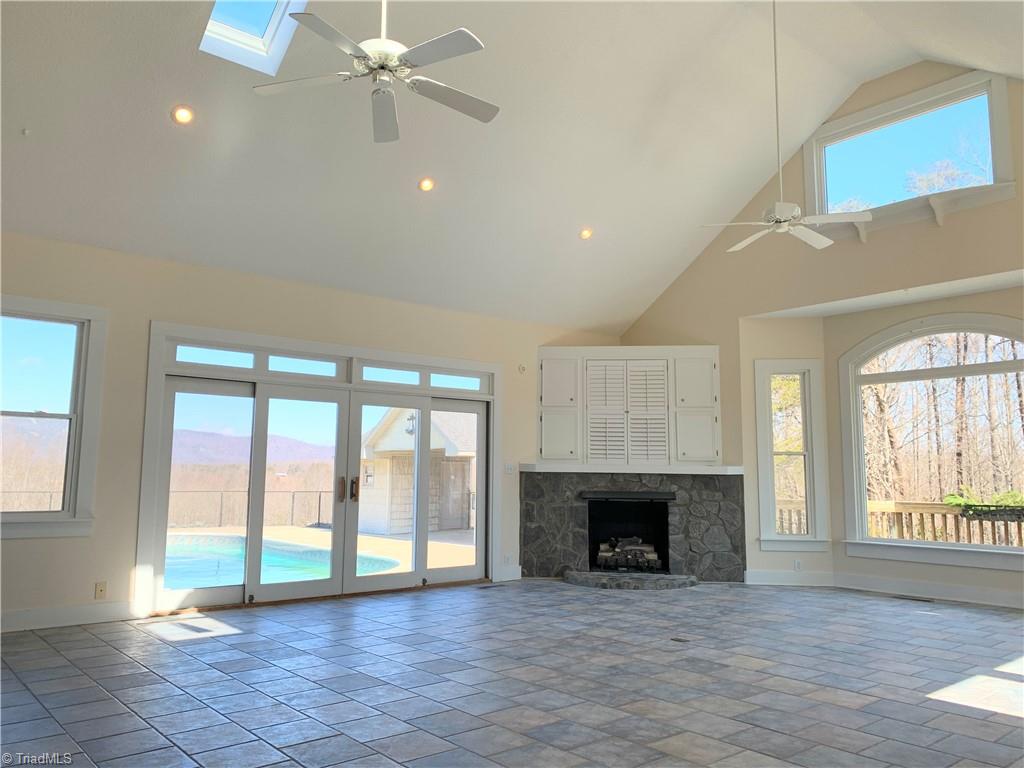 1198 Big Oak Road Germanton, NC 27019 - Photo 18 of 50 Den/four seasons room/sunroom is right off the kitchen. Light comes in from literally every angle.