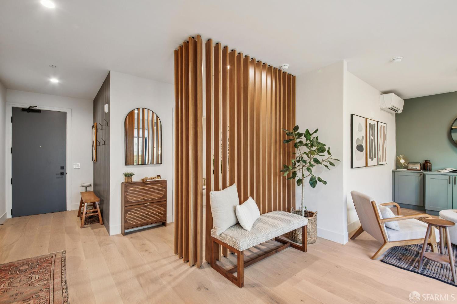 986 South Van Ness Avenue, Unit 203 San Francisco, CA 94110 - Photo 13 of 34 a living room with furniture and a potted plant