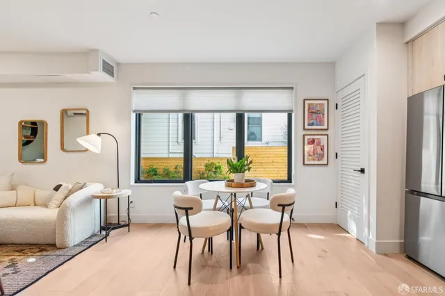 a view of a dining room with furniture window and outside view