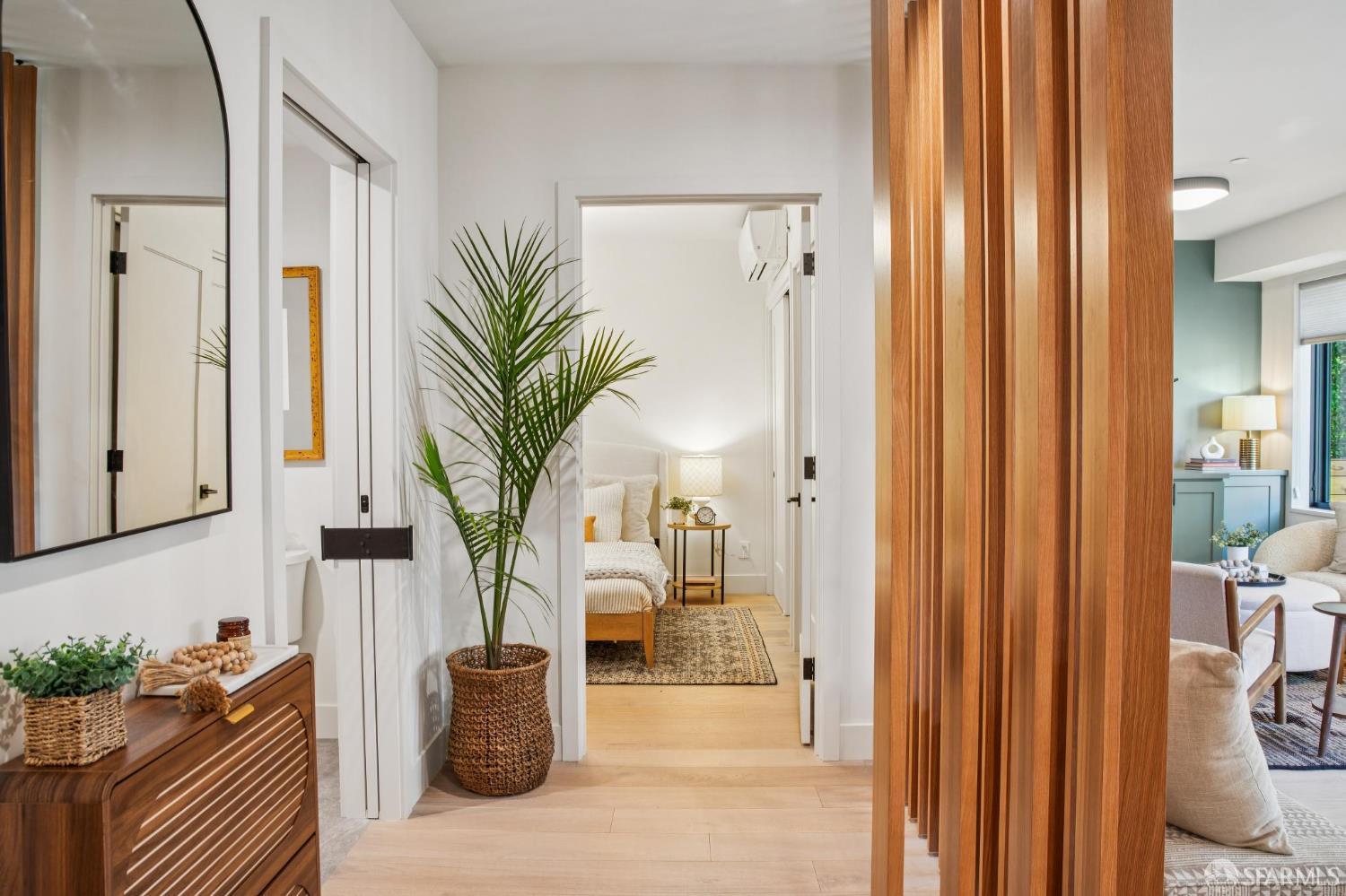 986 South Van Ness Avenue, Unit 203 San Francisco, CA 94110 - Photo 20 of 34 a potted plant sitting in front of a bathroom