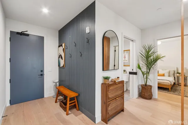 a view of living room with furniture and natural light