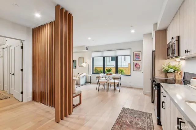 a view of a livingroom with furniture and a window