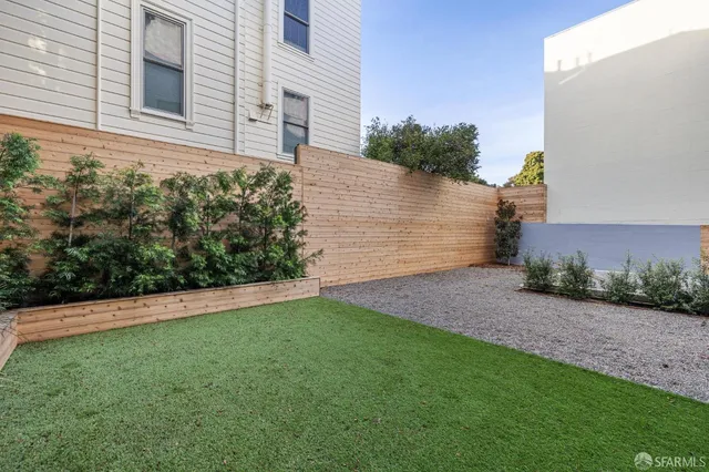 a view of a back yard of the house