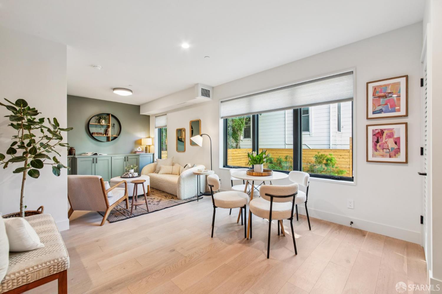 986 South Van Ness Avenue, Unit 203 San Francisco, CA 94110 - Photo 4 of 34 a living room with furniture and a large window