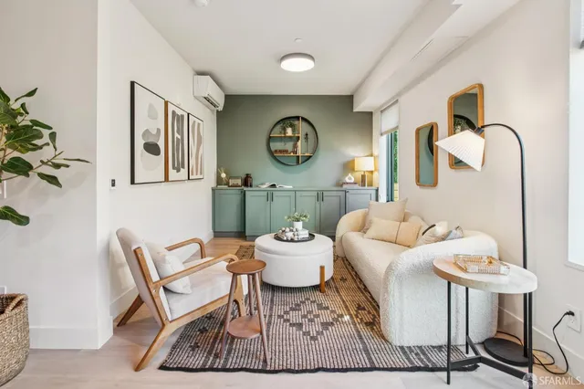 a dining room with furniture and wooden floor