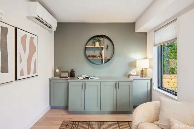 a bathroom with a sink mirror and vanity