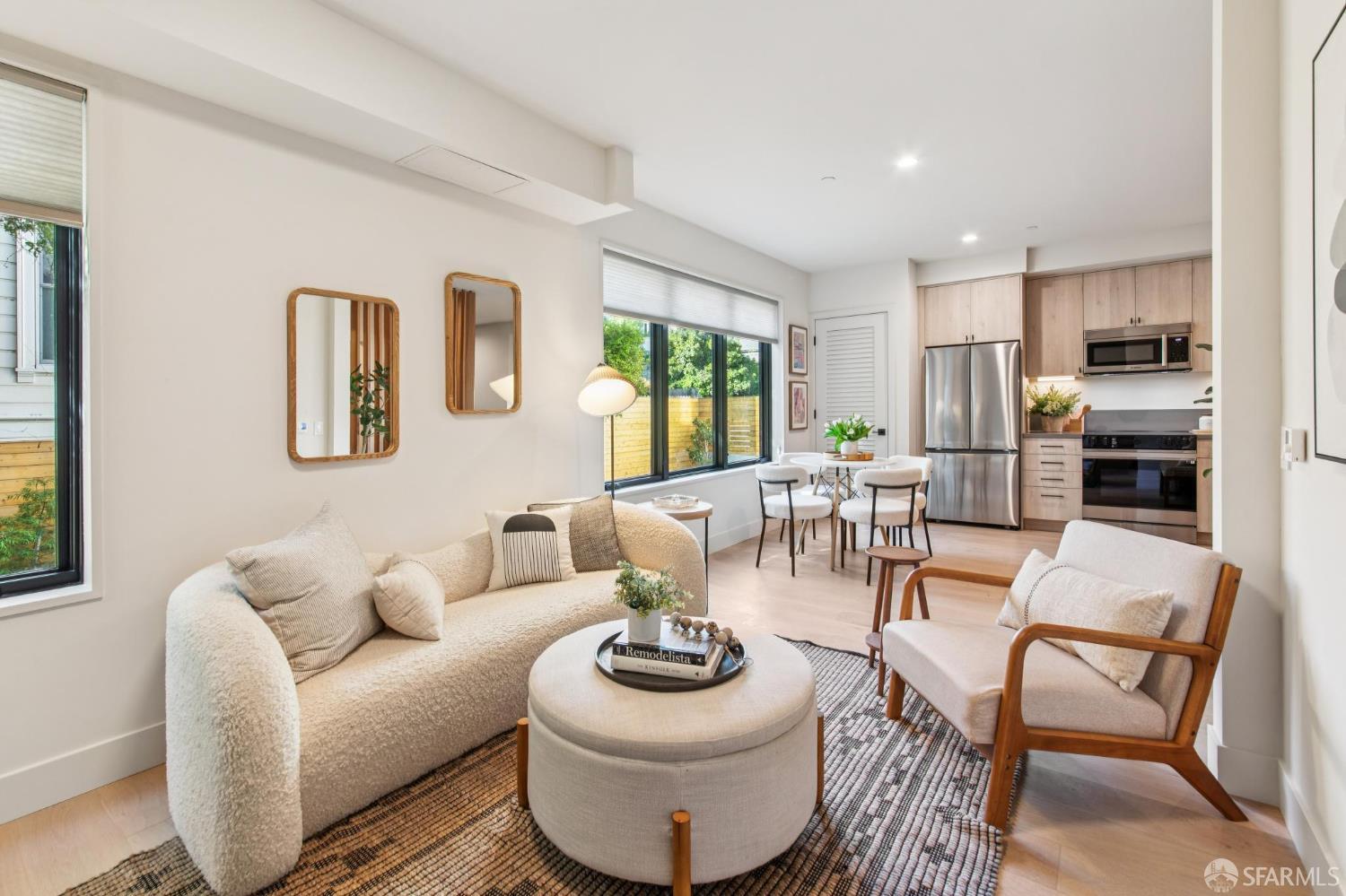 986 South Van Ness Avenue, Unit 203 San Francisco, CA 94110 - Photo 9 of 34 a living room with furniture and a large window