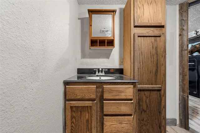 a view of kitchen with wooden floor