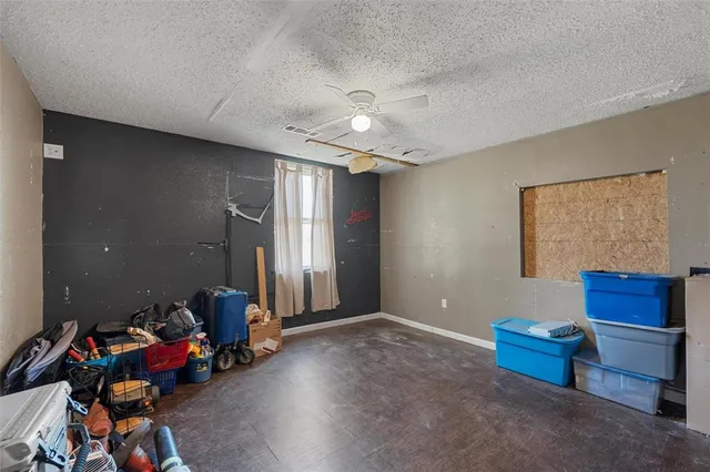 a living room with furniture and a pool table