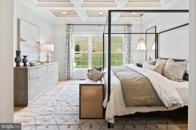 a bedroom with a bed and a lamp next to a window