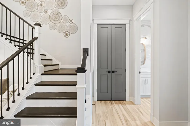 a view of entryway with wooden floor and windows
