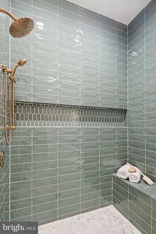 an aerial view of a tennis ground and a large pool