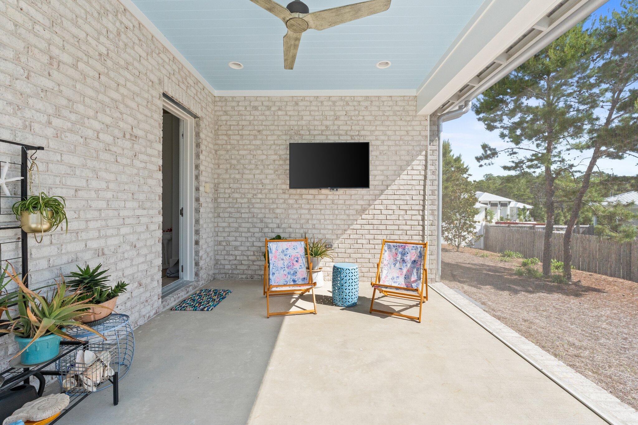 479 Ridge Road Santa Rosa Beach, FL 32459 - Photo 26 of 45 a backyard of a house with outdoor seating