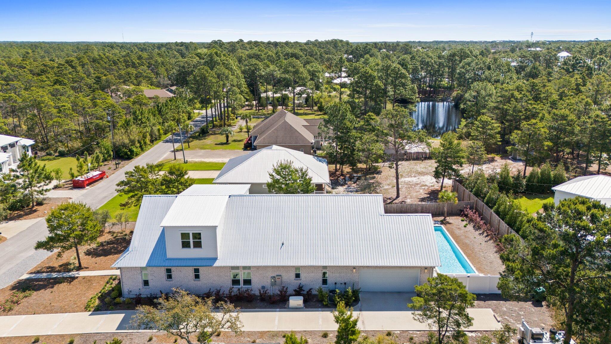479 Ridge Road Santa Rosa Beach, FL 32459 - Photo 43 of 45 an aerial view of residential houses with outdoor space and parking