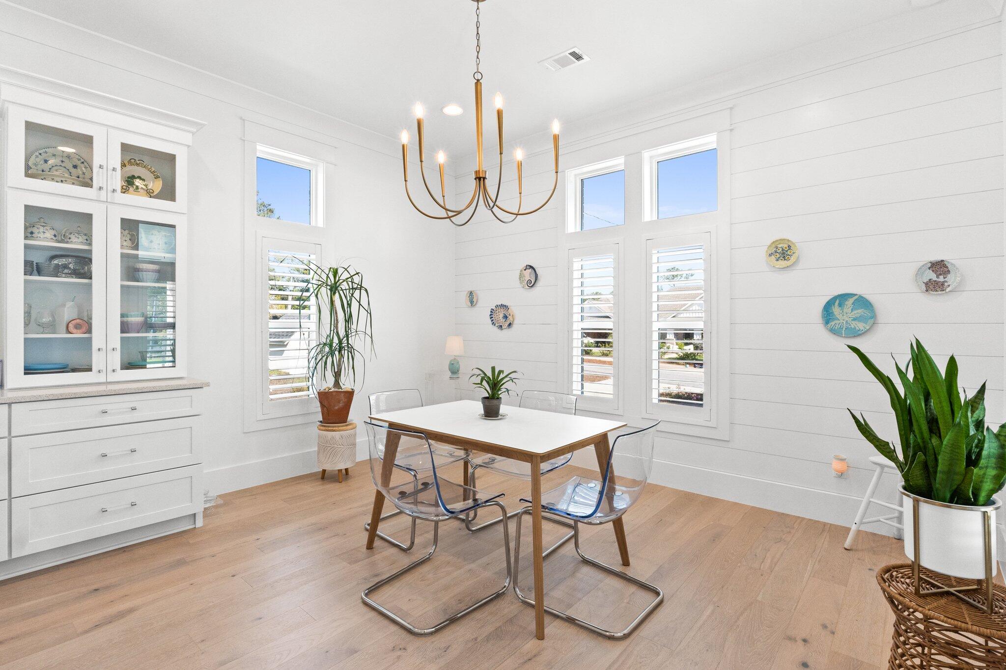 479 Ridge Road Santa Rosa Beach, FL 32459 - Photo 6 of 45 a view of a dining room with furniture window and wooden floor
