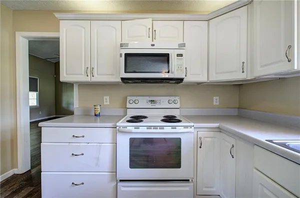 a view of room with window and hardwood floor