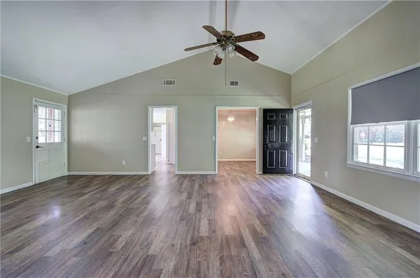 a view of a room with wooden walls