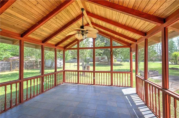 a view of a porch with a floor to ceiling windows