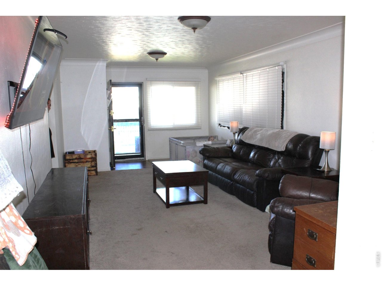 811 Prospect Street Fort Morgan, CO 80701 - Photo 14 of 19 a living room with furniture and a large window