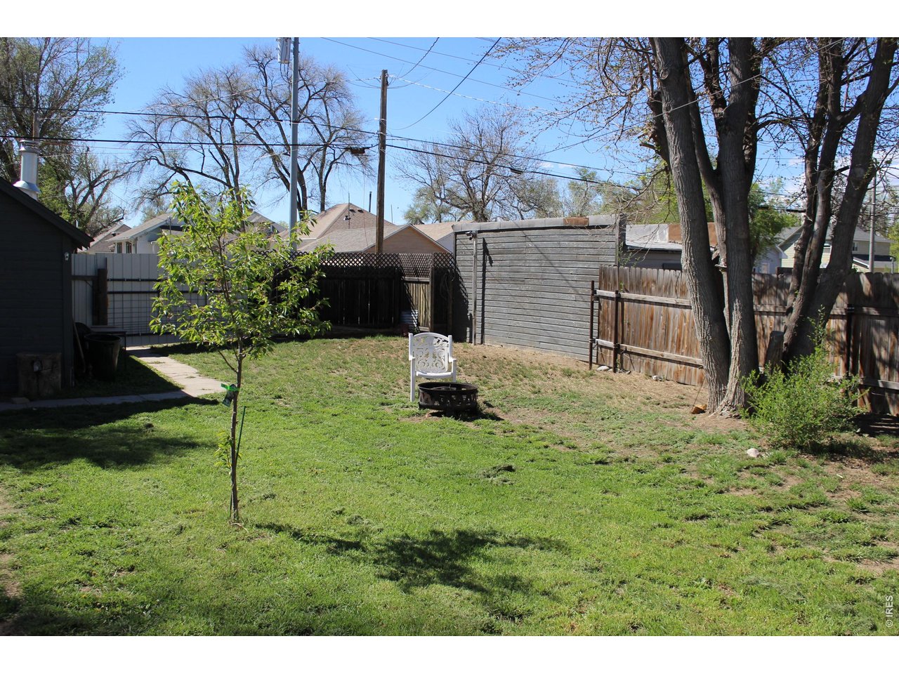 811 Prospect Street Fort Morgan, CO 80701 - Photo 16 of 19 a backyard of a house with table and chairs