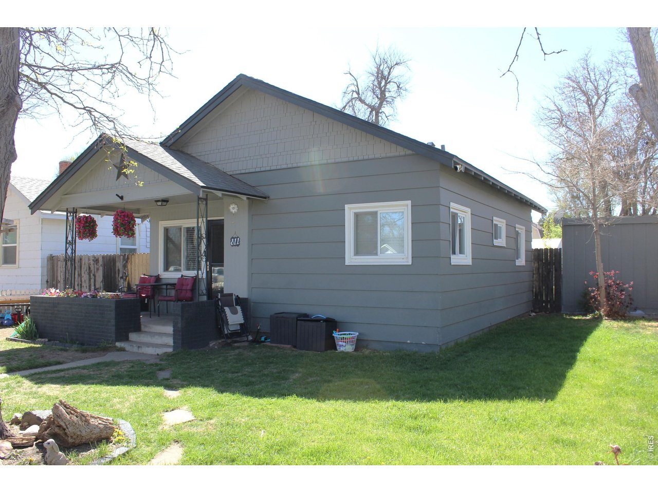 811 Prospect Street Fort Morgan, CO 80701 - Photo 2 of 19 a front view of house with yard and outdoor seating