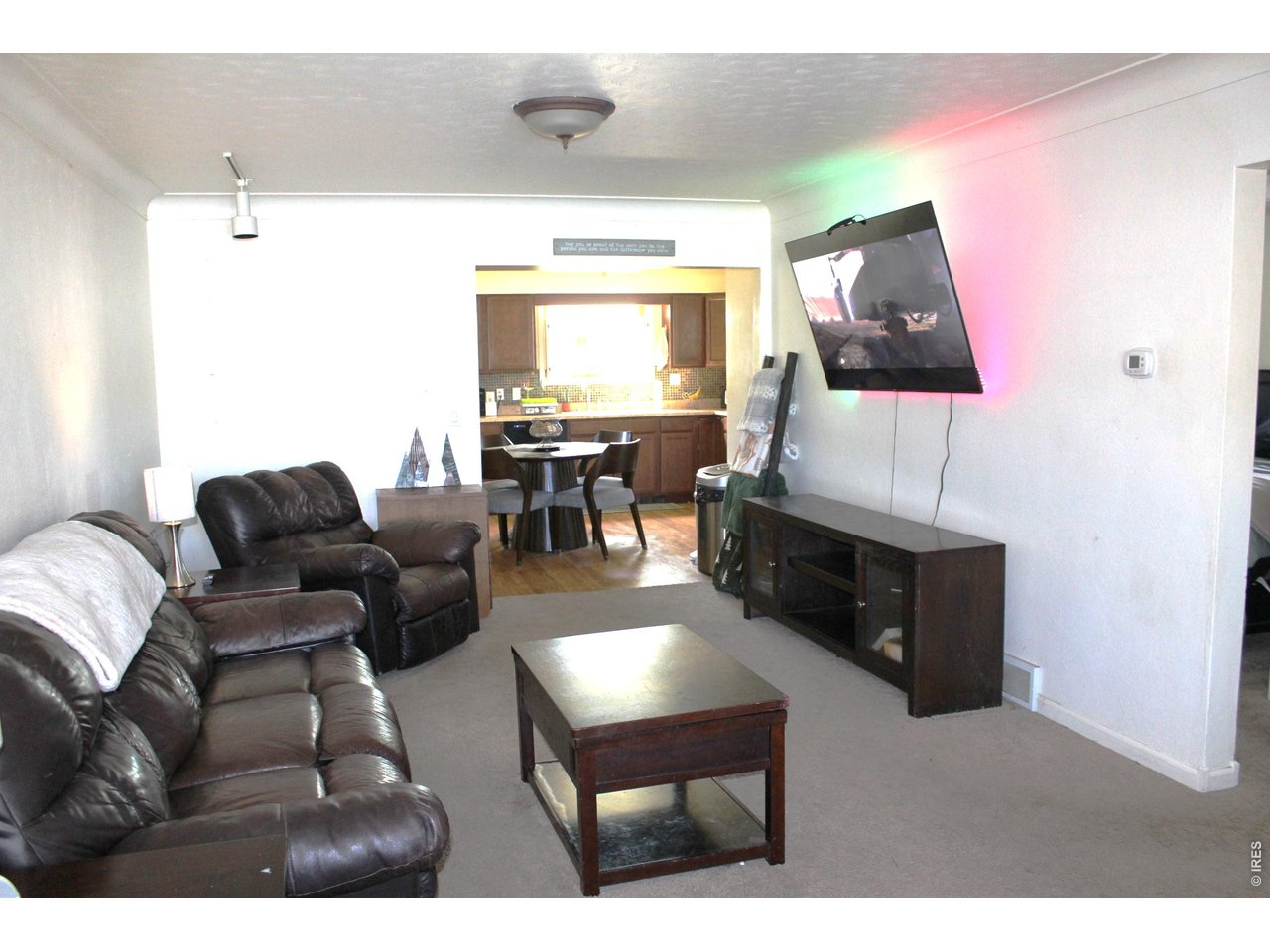 811 Prospect Street Fort Morgan, CO 80701 - Photo 4 of 19 a living room with furniture and a flat screen tv