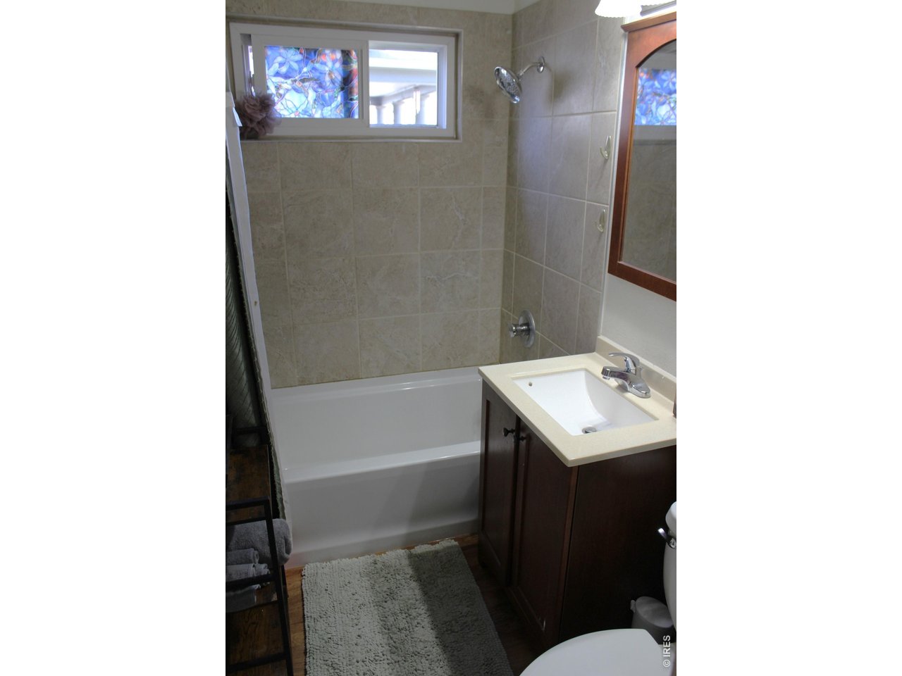 811 Prospect Street Fort Morgan, CO 80701 - Photo 8 of 19 a bathroom with a sink toilet and shower