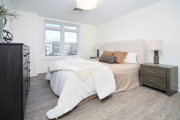 20 Penniman Road, Unit 101 Boston, MA 02134 - Photo 6 of 8 a bed room with a bed and a window