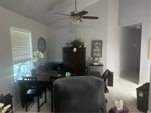 a dining room with furniture and window