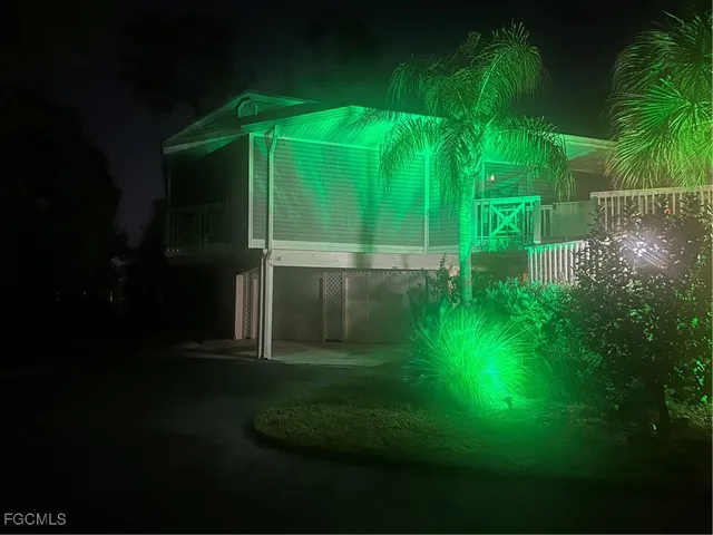 a backyard of a house with plants and garden