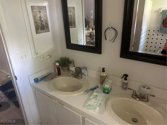 a bathroom with sink and mirror