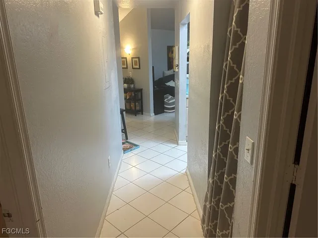 a view of a bathroom from a corridor