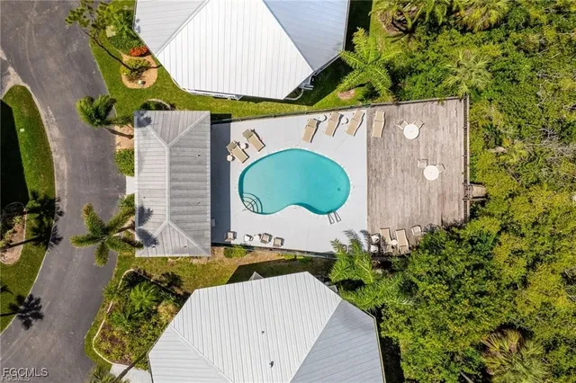 a wooden fence with some potted plants